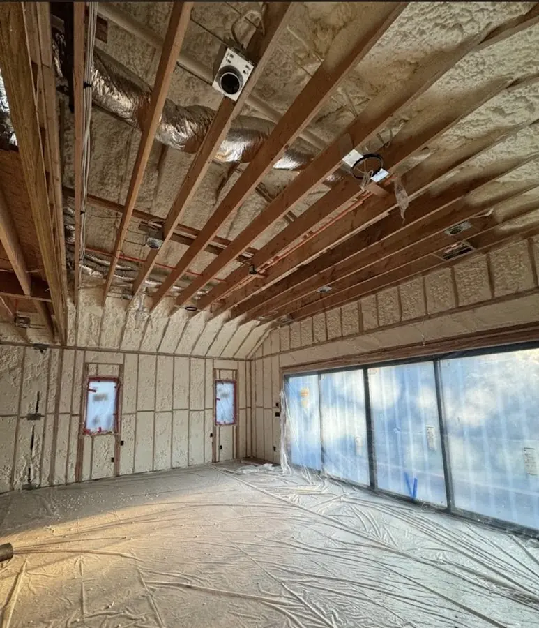 Interior walls and ceiling insulated with spray foam during new construction in Kaufman